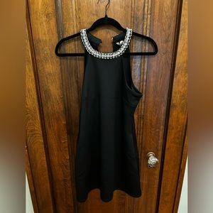 Black dress with detailed neckline of pearls and crystals.